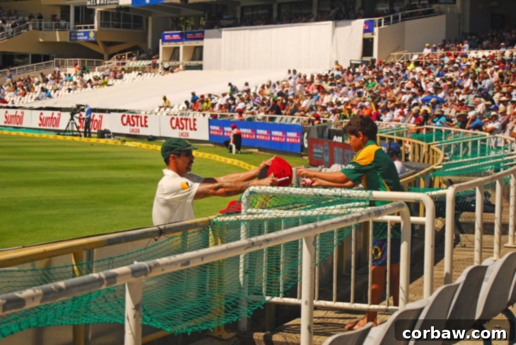 Cricket player signing autographs