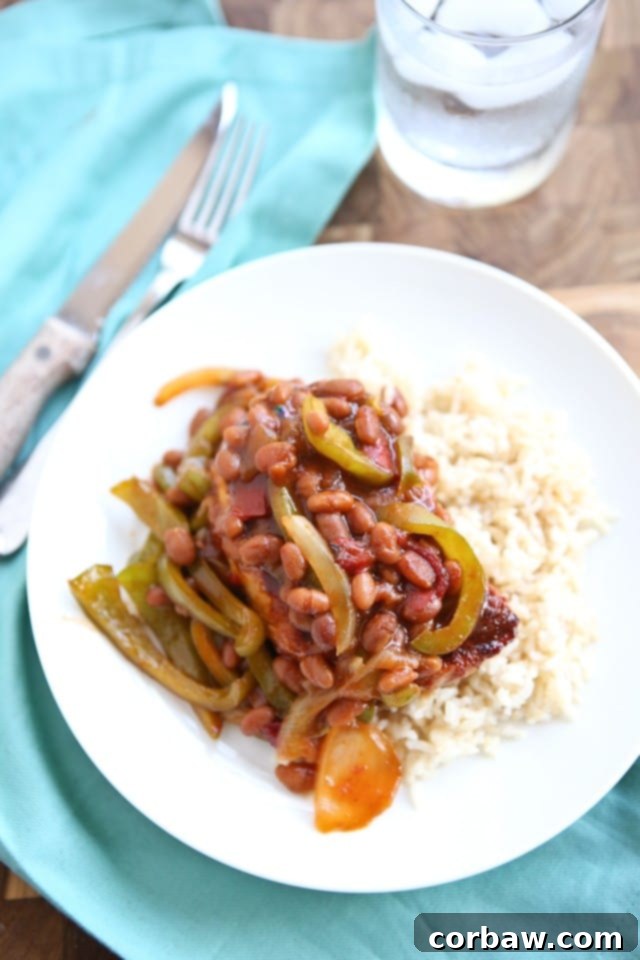 Grilled Pork Chops smothered in a special sauce made with baked beans, peppers and onions. So flavorful and an easy dinner to make - perfect for grilling season! Grilled Pork Chops smothered in a special sauce made with baked beans, peppers and onions. So flavorful and an easy dinner to make - perfect for grilling season!