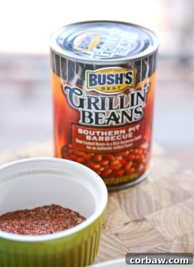 Grilled Pork Chops smothered in a special sauce made with baked beans, peppers and onions. So flavorful and an easy dinner to make - perfect for grilling season! Juicy Grilled Pork Chops generously covered in a flavorful, homemade sauce featuring baked beans, bell peppers, and sweet onions. A truly satisfying and easy dinner, ideal for warm weather grilling.