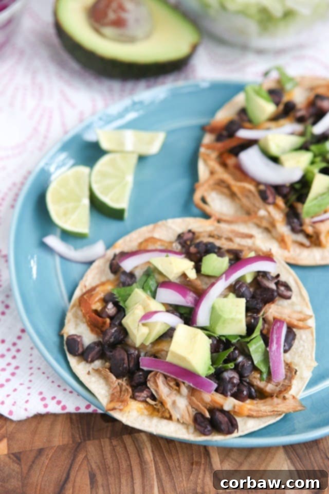 Slow Cooker Salsa Verde Pork Tostadas - all you need is a few ingredients and a little help from your slow cooker to put together this delicious, healthy baked tostada dinner your whole family will love.
