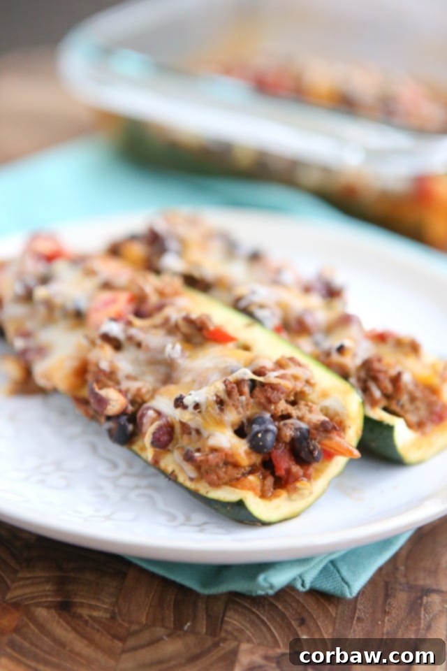 Leftover Chili Stuffed Zucchini Boats - great way to use up leftover chili, low carb and very filling. Great for anyone trying to lose weight!