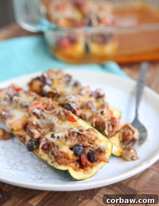 Leftover Chili Stuffed Zucchini Boats - great way to use up leftover chili, low carb and very filling. Great for anyone trying to lose weight!