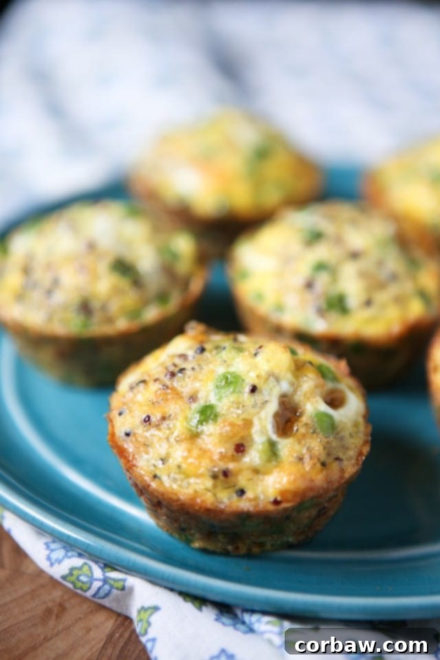 Savory Egg Cups 4 egg and quinoa muffins with peas on blue plate
