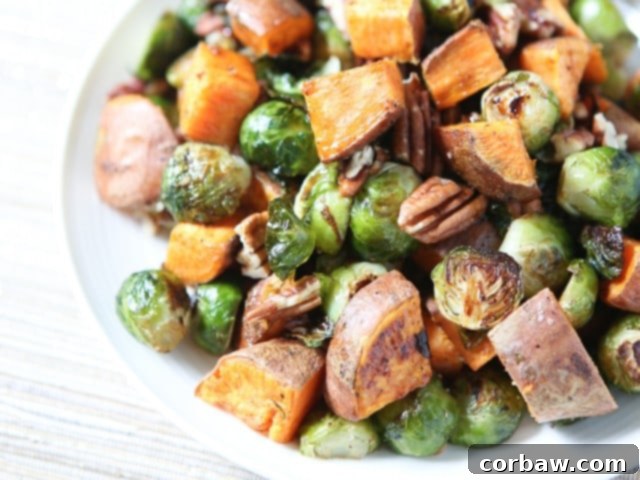 Beautifully roasted sweet potatoes and Brussels sprouts adorned with pecans and a delicious glaze, embodying the spirit of fall. A #ThinkFisher creation perfect for any holiday meal.