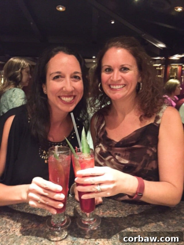 Two Pomegranate Rum Cocktails served in tall glasses, expertly shaken and garnished, ready to be enjoyed.