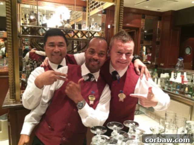 A close-up view of a Pomegranate Rum Cocktail being poured into a glass filled with ice, illustrating the preparation process.