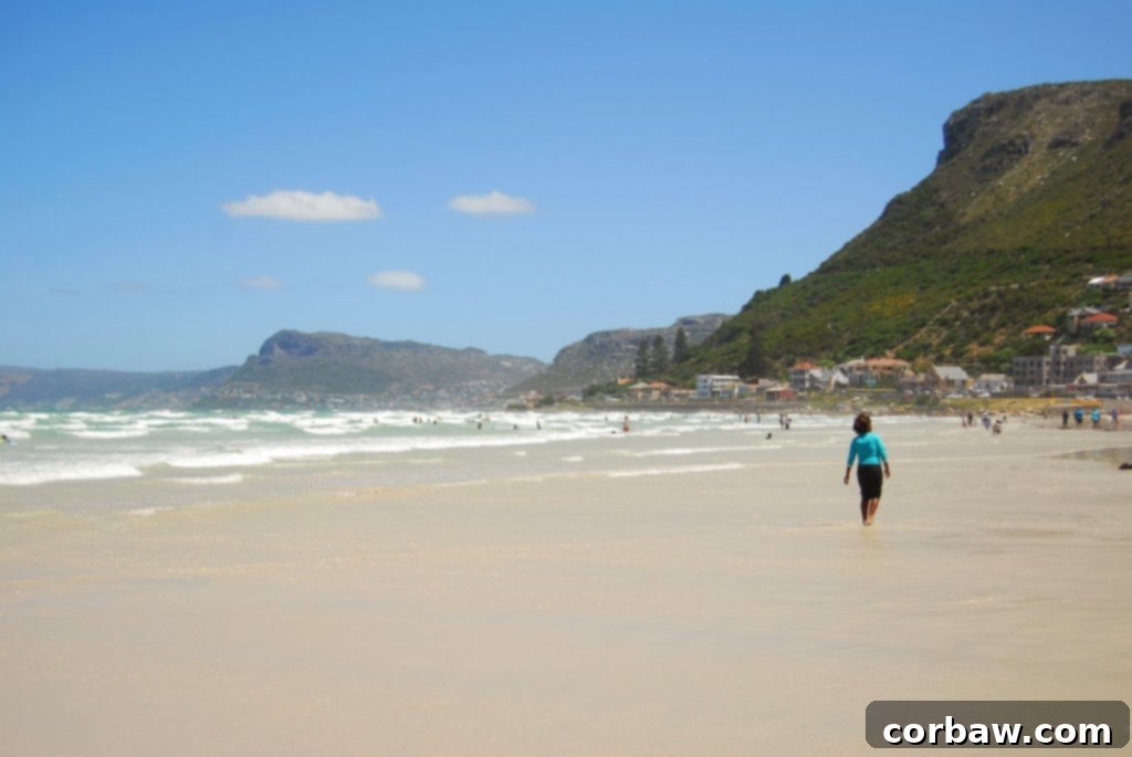 The expansive sandy shores of Muizenberg Beach, popular for surfing and swimming