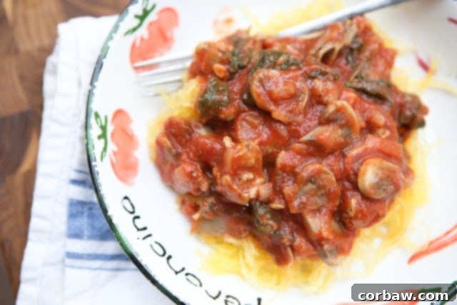 Spaghetti Squash with Sausage and Mushroom Bolognese This Spaghetti Squash with Sausage and Mushroom Bolognese is a hearty low carb meal full of flavor! One of my favorites.