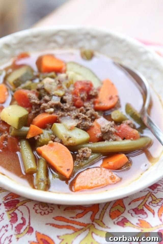 Smoky White Bean and Sausage Stew with Spinach 4 A hearty bowl of Italian Vegetable Beef Soup, brimming with lean beef, a colorful medley of vegetables, and seasoned with aromatic Italian herbs.