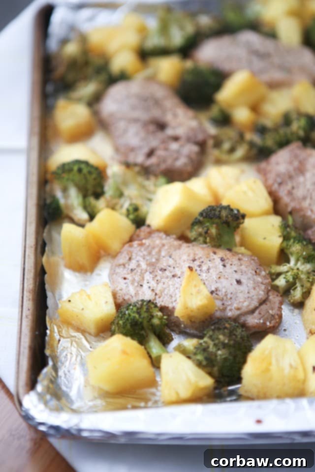 Delicious Chinese Five Spice Pork Chops, roasted with vibrant green broccoli florets and sweet caramelized pineapple chunks, all cooked on a single sheet pan for an easy weeknight dinner. Inspired by a beloved cookbook.