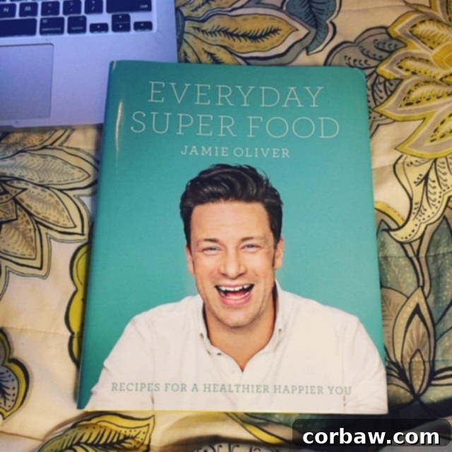 Friday Freedom 3 Jamie Oliver's Everyday Superfood cookbook, open to a vibrant recipe, symbolizing healthy and exciting culinary inspiration.