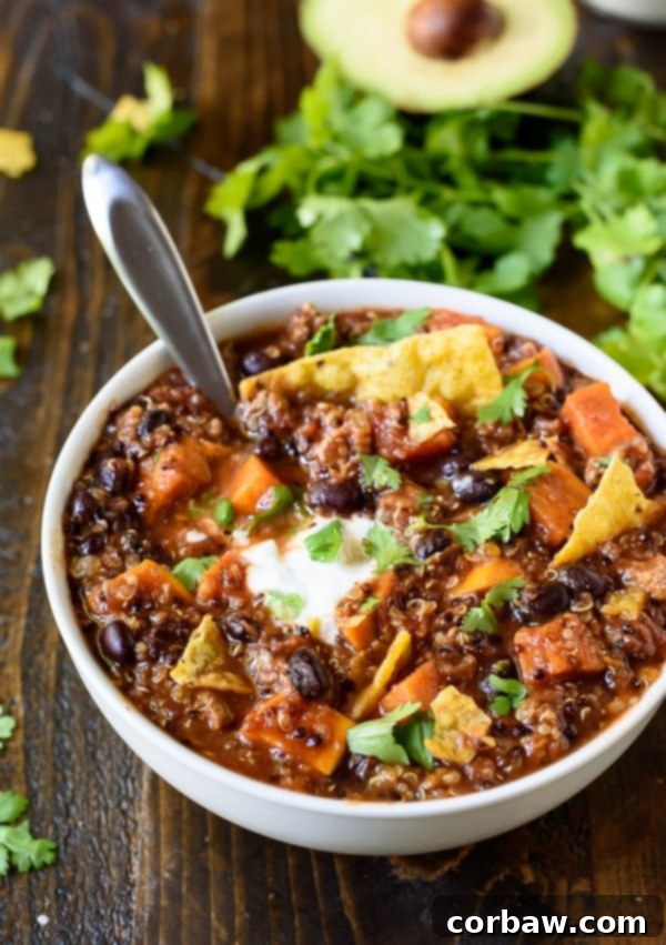 Friday Freedom 4 The BEST Slow Cooker Turkey Quinoa Chili from WellPlated.com - A hearty bowl of chili topped with fresh herbs.