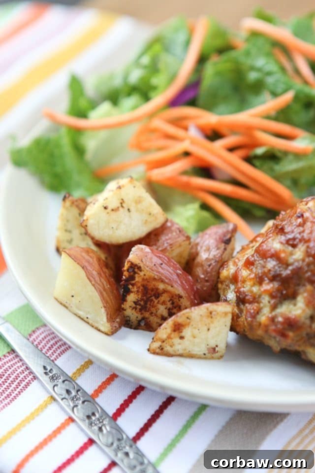 Roasted Potatoes Side Dish Oven-roasted baby red potatoes, perfectly seasoned and cooked, ready to serve with Mini Honey Mustard Meatloaf.