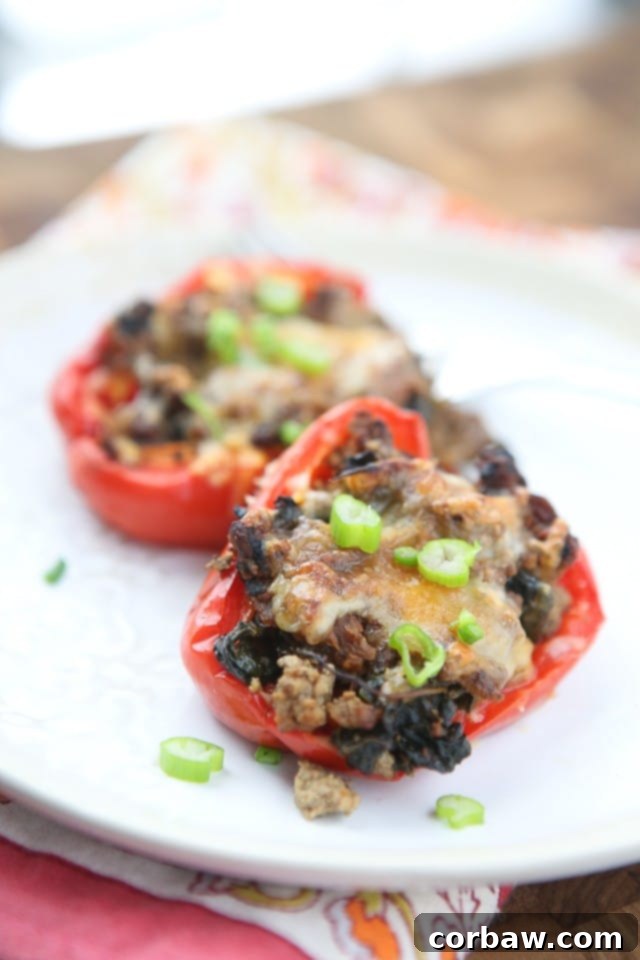 Simple and healthy, this low carb recipe for Beef and Spinach Stuffed Peppers was a huge hit for weeknight dinners and meal prep.