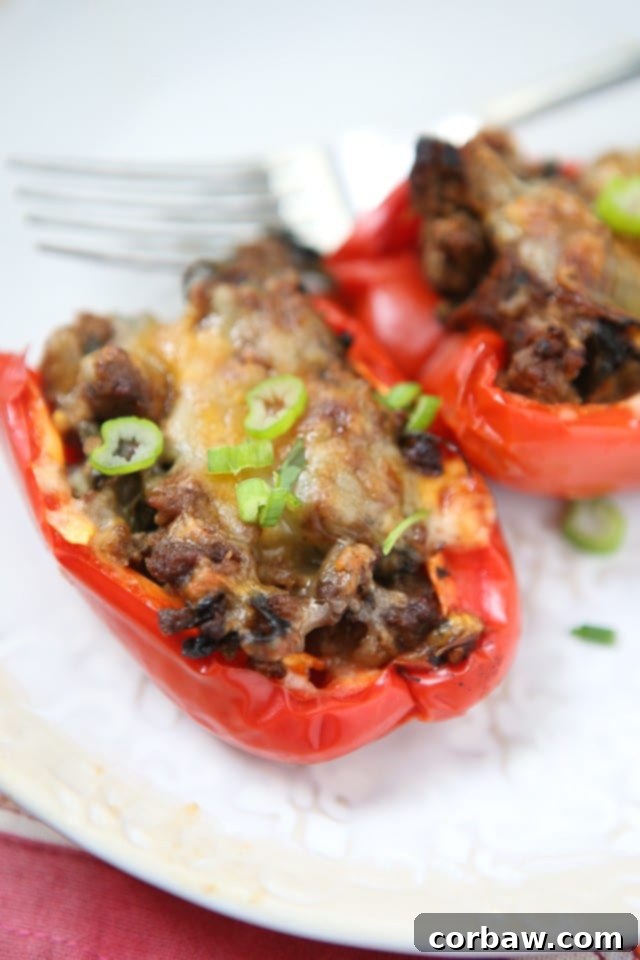 Simple and healthy, this low carb recipe for Beef and Spinach Stuffed Peppers was a huge hit for weeknight dinners and meal prep.