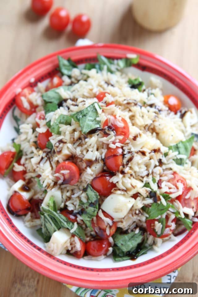 This Caprese Rice Salad recipe is bursting with fresh flavors! Great side dish for grilled meats or double the recipe to take to a barbecue or picnic. 
