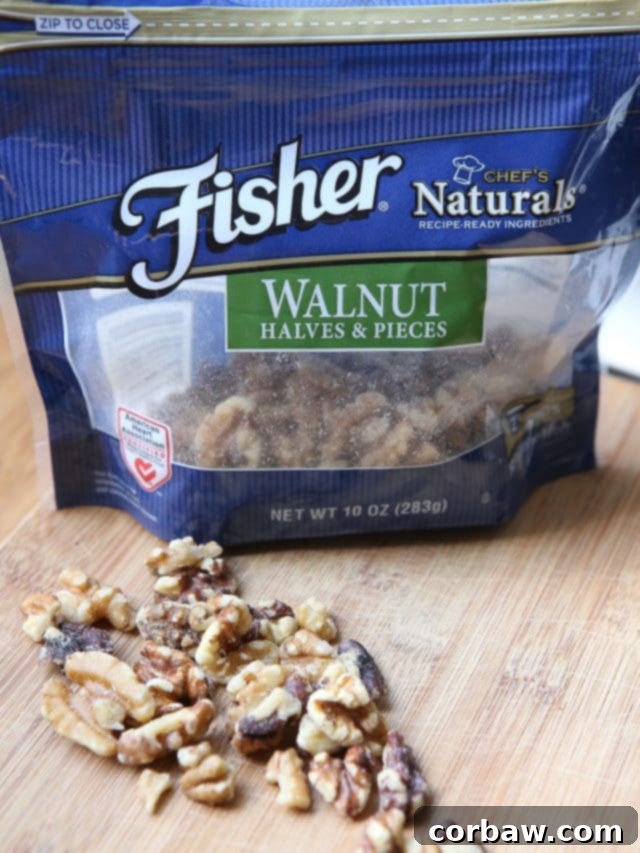 Close-up of Whole Wheat Penne Pasta with creamy Ricotta, vibrant green Zucchini, and toasted Walnuts, showcasing the fresh ingredients.