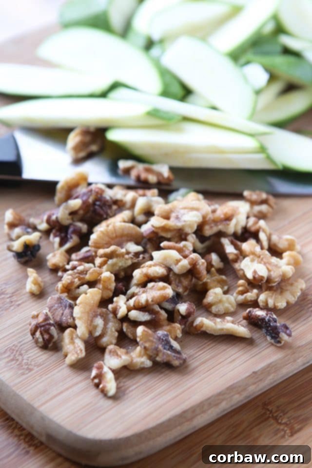 A bowl of Whole Wheat Pasta with Ricotta, Zucchini, and Walnuts, garnished with fresh herbs and Parmesan cheese, ready to be enjoyed.