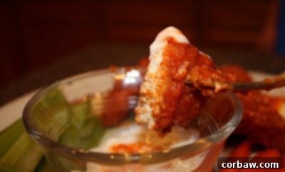 Fiery Garlic Oven Chicken Bites 3 Close-up of golden brown, crispy baked chicken strips, ready to be sauced. These boneless chicken pieces are perfectly cooked for a healthy wing alternative.