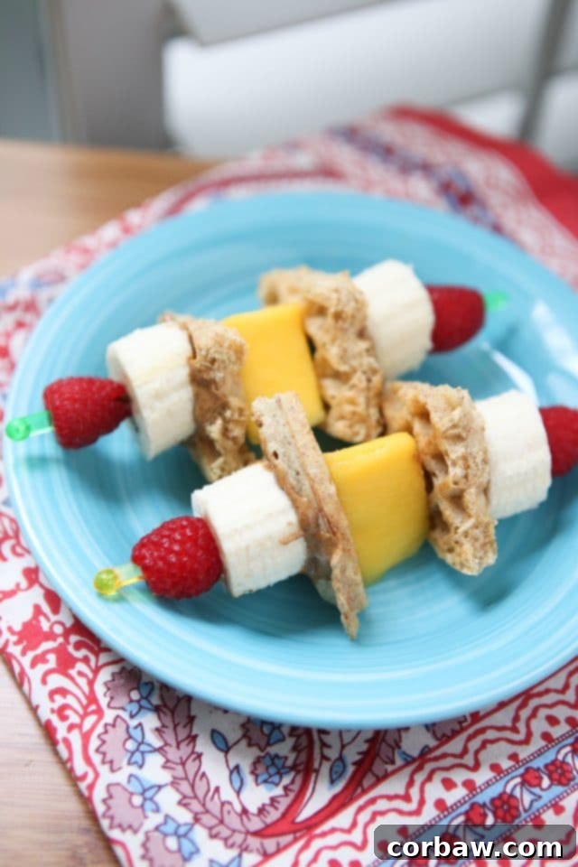 Rainbow Fruit Skewers 2 Fun breakfast idea for you and the kids! Breakfast Fruit Skewers (with whole grain waffles & nut butter) inspired by Produce for Kids, perfect for a healthy start.