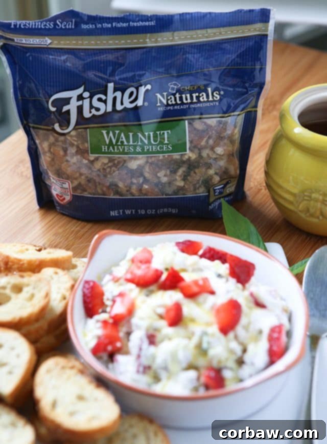An inviting image perfect for a summer gathering: Strawberry Basil Goat Cheese Spread with Walnuts served on crunchy toasts, drizzled with honey. A truly delicious appetizer recipe.