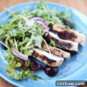 Grilled Chicken with Cherry Arugula Salad - a perfect summer meal. Light, low carb and filled with fresh flavor. Recipe via aggieskitchen.com
