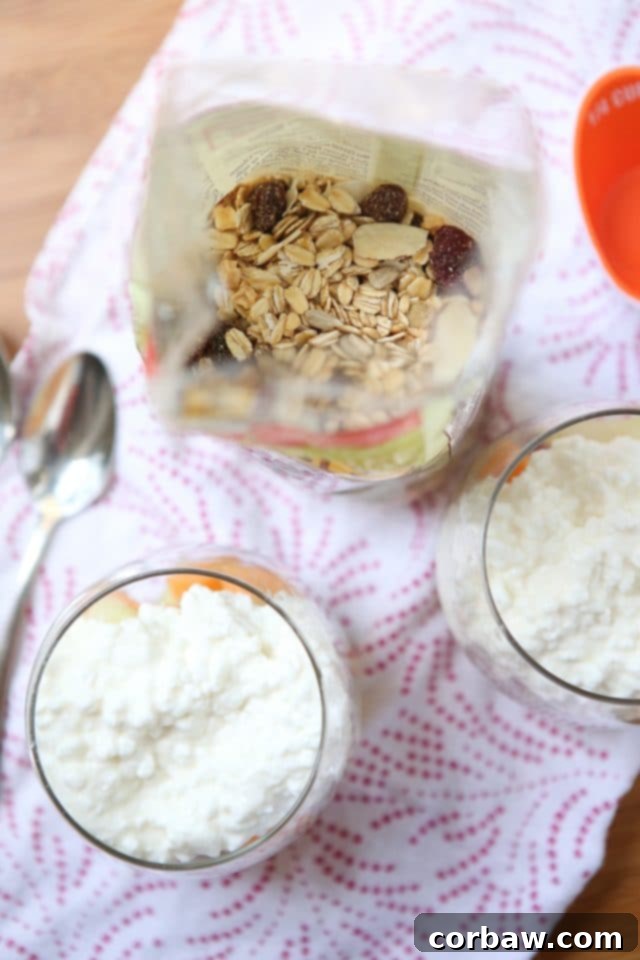 Close-up of the delightful texture and ingredients in a Summer Melon Protein Parfait, highlighting the fresh melon, creamy cottage cheese, and the wholesome Bob's Red Mill Muesli blend.
