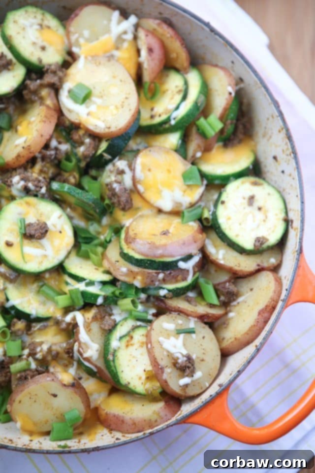 One-Pan Cheesy Southwest Beef and Potatoes 7 Serving of the Cheesy Southwest Beef and Potato Skillet, garnished with fresh cilantro, ready to be enjoyed.