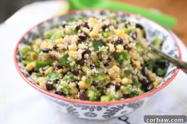 This Corn and Black Bean Quinoa Salad is perfect on its own or as a make-ahead side dish for any meal. Recipe via aggieskitchen.com A bowl of Corn and Black Bean Quinoa Salad ready to be served, showcasing its fresh ingredients and vibrant colors. Emphasizes its role as a versatile meal prep option or a healthy side. Recipe via aggieskitchen.com
