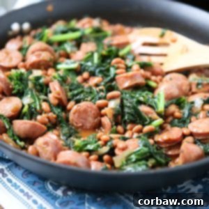 Easy comfort food your family will love! Baked Bean, Sausage & Kale Skillet - comes together fast, perfect for busy weeknights! Recipe via aggieskitchen.com