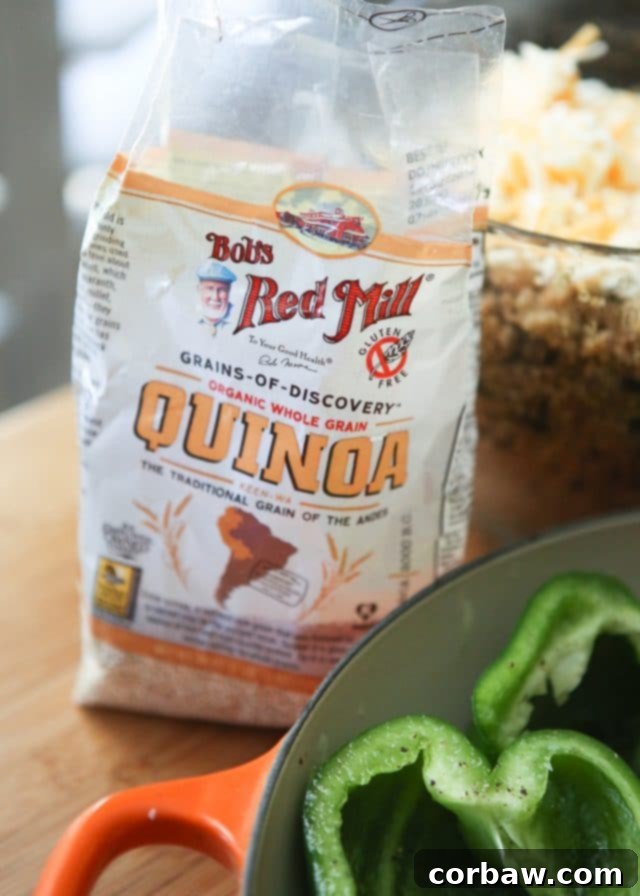 Veggie Enchilada Stuffed Peppers 4 A selection of fresh ingredients for Vegetarian Enchilada Stuffed Peppers, including Bob's Red Mill Organic Quinoa, canned black beans, vibrant bell peppers, and various seasonings.