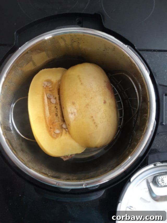 How To Cook Spaghetti Squash in the Instant Pot two spaghetti squash halves in the bowl of an Instant Pot before cooking, demonstrating setup