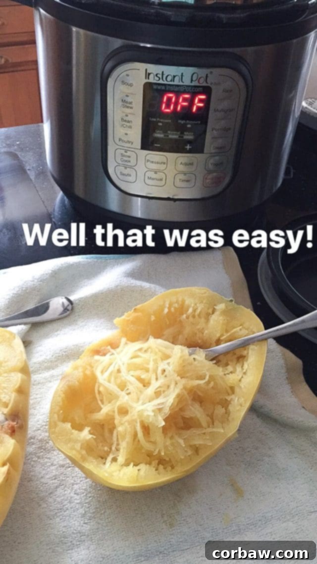 How To Cook Spaghetti Squash in the Instant Pot cooked spaghetti squash on counter with Instant Pot in the background, showing perfectly scraped strands