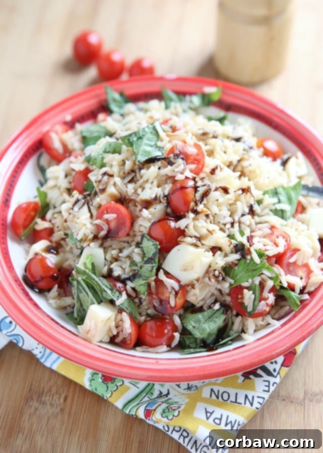 2016's 12 Most Popular Recipes My Must-Make List 7 Vibrant Caprese Rice Salad with cherry tomatoes, fresh mozzarella balls, basil leaves, and rice, drizzled with balsamic glaze.