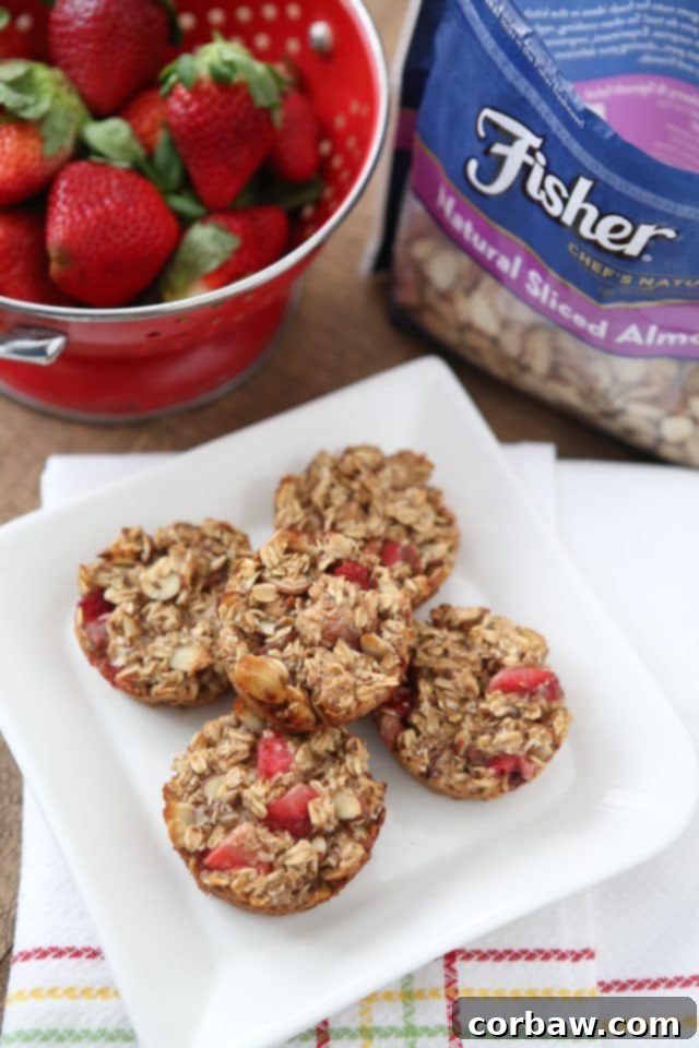 Delicious Strawberry Almond Oatmeal Bites, perfect for a healthy on-the-go breakfast or snack, featuring Fisher Nuts almonds. Recipe via aggieskitchen.com #ThinkFisher