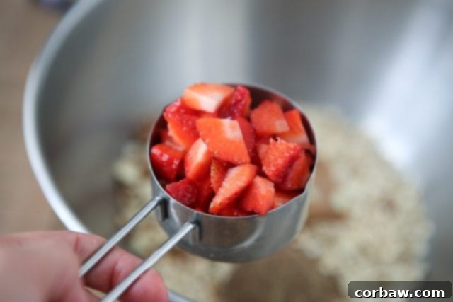 Strawberry Almond Energy Bites 5 Ingredients for Strawberry Almond Oatmeal Bites, including fresh strawberries and Fisher Sliced Almonds. aggieskitchen.com #ThinkFisher