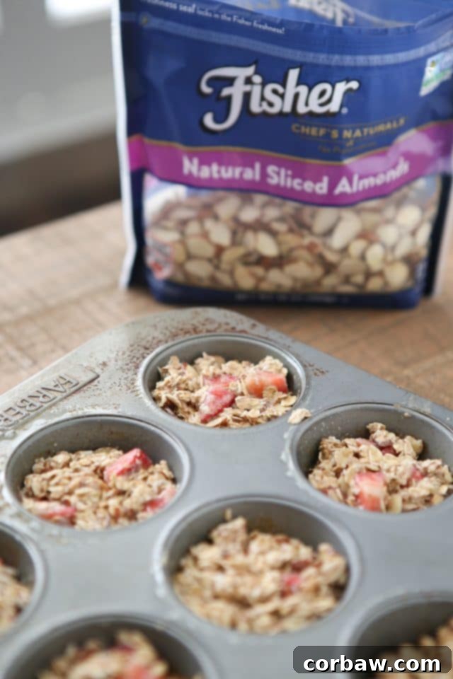 Strawberry Almond Energy Bites 6 Platter of freshly baked Strawberry Almond Oatmeal Bites, garnished with extra sliced almonds and fresh strawberries, a truly heart-healthy snack. aggieskitchen.com #ThinkFisher