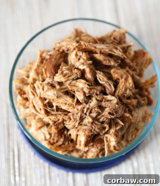 Make a weekly batch of this Slow Cooker Shredded Barbecue Chicken recipe - so many ways to use it in meals!