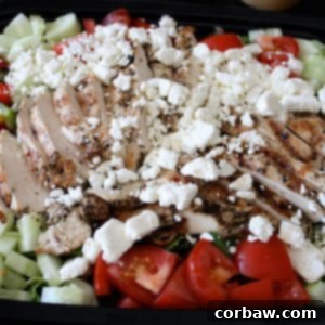 A vibrant Greek Grilled Chicken Salad, ready to be served.