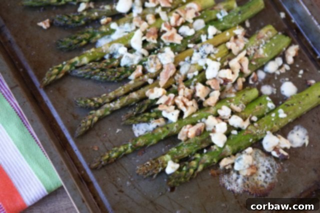 Plated Roasted Asparagus with Balsamic, Gorgonzola and Walnuts, ready to serve.