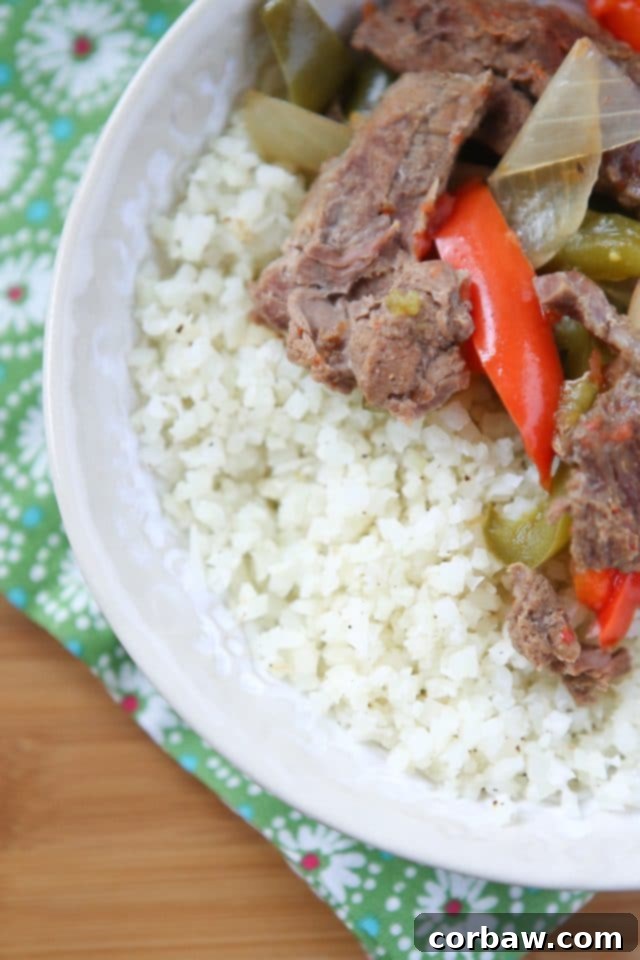 Healthy Serving Ideas for Pepper Steak: Cauliflower Rice Serving of Slow Cooker Pepper Steak with a side of cauliflower rice, showcasing a healthy and delicious meal.