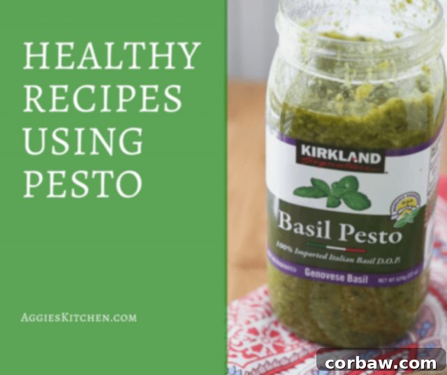 Delicious pasta with vibrant green pesto, garnished with fresh basil leaves and cherry tomatoes