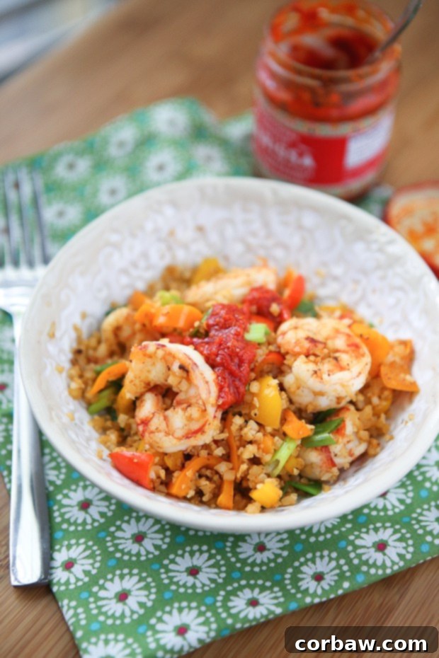 Quick lunch or dinner for one! Cajun Shrimp and Cauliflower Rice Stir Fry - low carb, high protein and full in flavor.