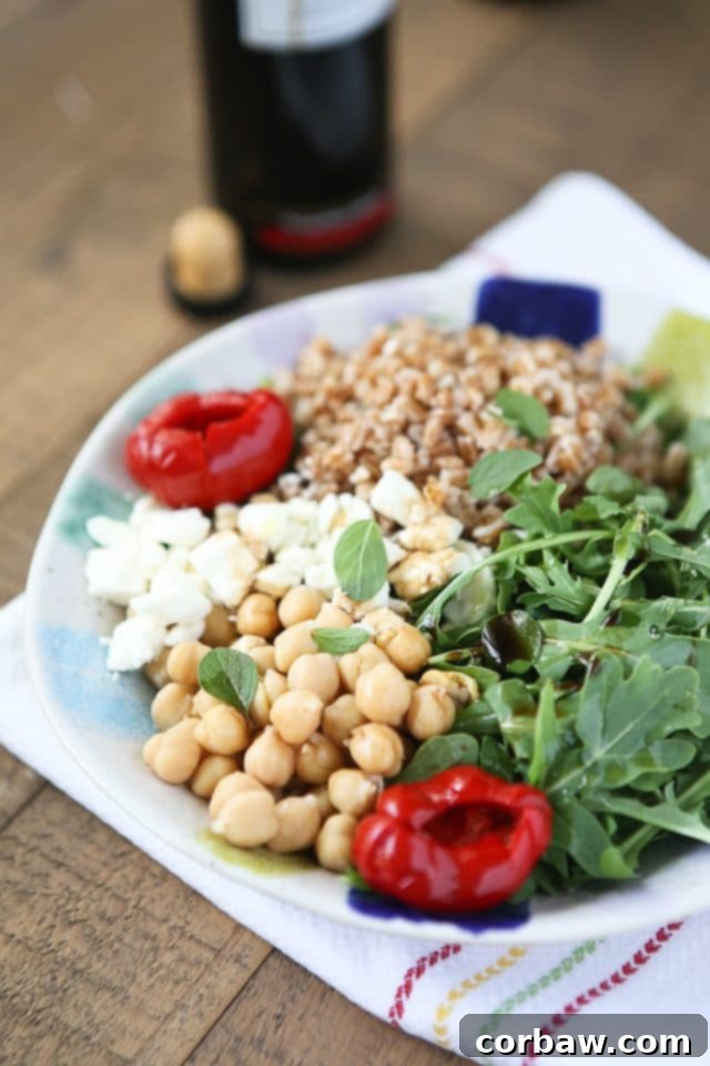 A vibrant and nutritious Mediterranean Farro Salad featuring fresh arugula and protein-rich chickpeas, perfect for a healthy vegetarian meal or Meatless Monday. Recipe via aggieskitchen.com This Mediterranean Farro Salad with Arugula & Chickpeas is a hearty & healthy vegetarian whole grain dish. Great source of protein and fiber! Perfect for Meatless Monday! Recipe via aggieskitchen.com