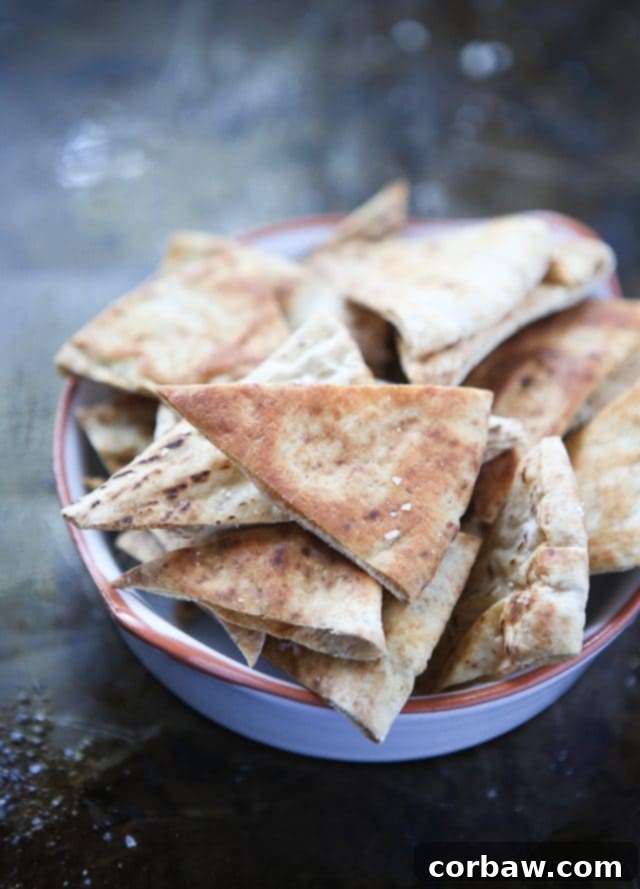 Homemade Baked Pita Chips crispy baked pita chip triangles in a bowl