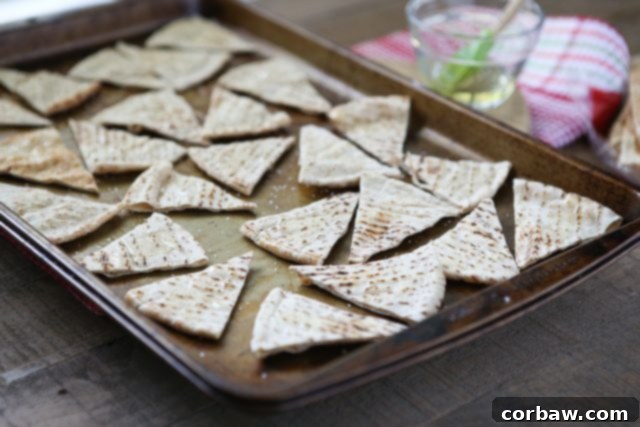 Homemade Baked Pita Chips sheet pan filled with pita triangles before baking
