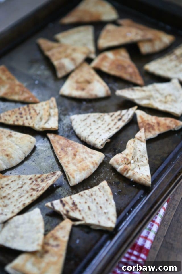 homemade baked pita chips sheet pan with crispy baked pita chip triangles