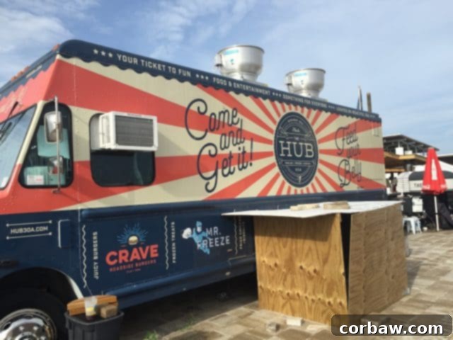 Casual and inviting outdoor space at The Hub 30A for dining and entertainment Outdoor seating area at The Hub 30A, designed for comfort and community interaction