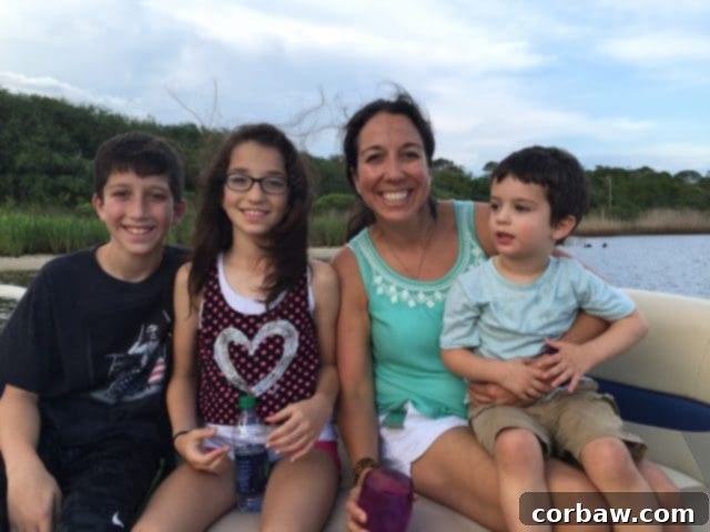 Family enjoying a picturesque pontoon boat ride on Big Redfish Lake to the beach Pontoon boat on Big Redfish Lake, transporting families to the pristine 30A beach