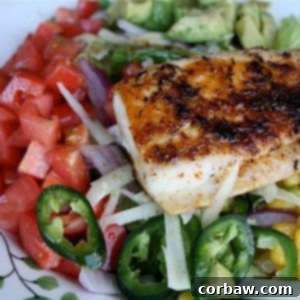 Blackened Fish Taco Salad with fresh vegetables and fish.
